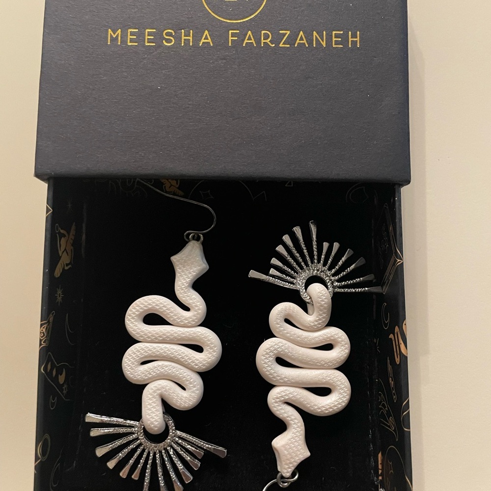 Meesha Farzaneh the Medusa snake earrings. White and silver with box